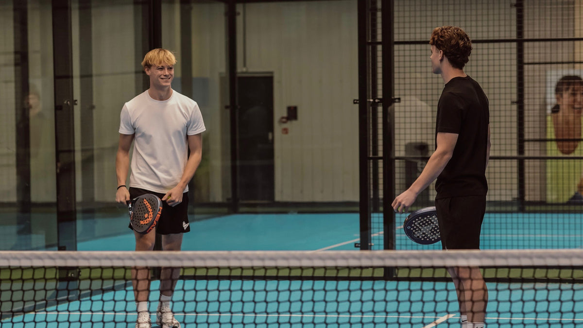 Padel Source founders wearing Padel Source performance clothing on court.