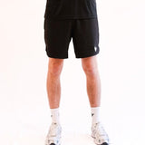 Male athlete wearing black athletic Padel Source Pro Performance 7