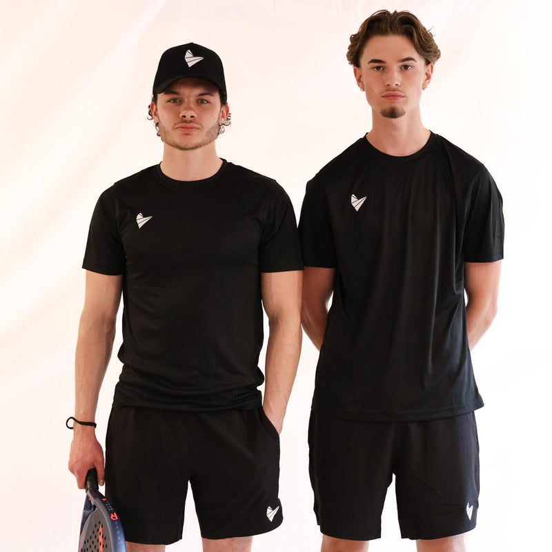 Two men wearing black athletic outfits with a logo, standing side by side against a plain background.