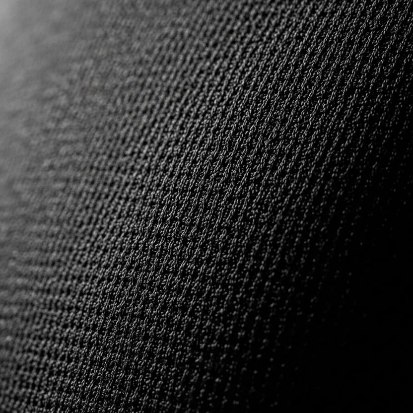 Close-up shot of Padel Source fabrics used in padel clothing.